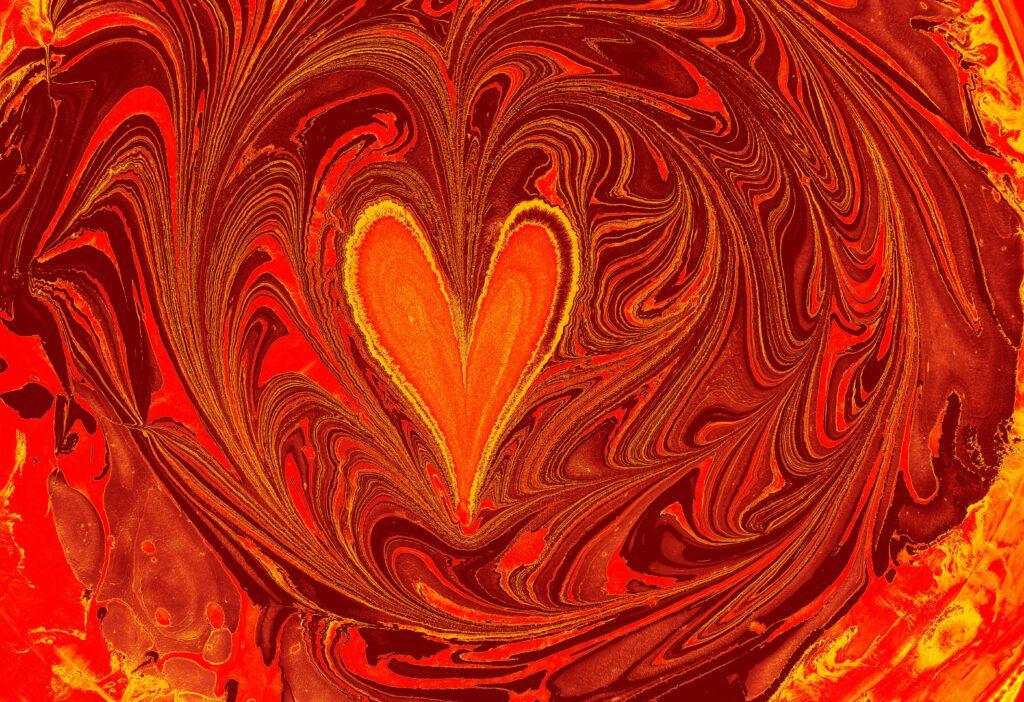 Dynamic abstract design featuring bold red and orange swirls with a heart shape center.